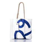 The Sea Bags Vintage Rhodes 19 Medium Tote is a white sailcloth bag featuring a blue abstract design, rope handles, and a stitched tag. Handmade in Maine and inspired by the Vintage Rhodes 19 tote, it is showcased against a white background. by Sea Bags