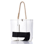 The Sea Bags Vintage Black 2 Medium Tote features a striking black abstract design on a white background, accented by distinctive zigzag stitching at the top and a signature white tag. Its hand-spliced rope handles evoke classic vintage sail totes, showcasing the meticulous craftsmanship typical of Maine-made Sea Bags creations. by Sea Bags