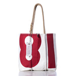 Introducing the Sea Bags Vintage 81 Medium Tote: a Maine-crafted bag featuring a classic white and red sail design with a bold number 81, hand-spliced rope handles, and a signature white SEA BAGS tag. This tote combines timeless nautical style with durable functionality. by Sea Bags