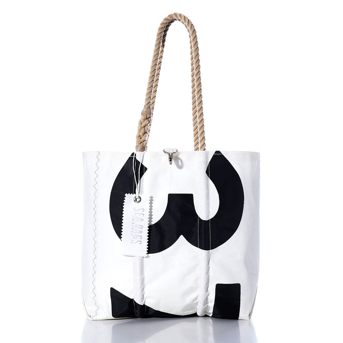 Introducing the Sea Bags Vintage 375 Medium Tote: a white tote bag crafted from authentic vintage sailcloth, featuring hand-spliced rope handles, a bold black 375 on the front, and an attached Sea Bags tag—reflecting the tradition of Maine handcrafted bags. by Sea Bags