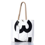Introducing the Sea Bags Vintage 375 Medium Tote: a white tote bag crafted from authentic vintage sailcloth, featuring hand-spliced rope handles, a bold black 375 on the front, and an attached Sea Bags tag—reflecting the tradition of Maine handcrafted bags. by Sea Bags