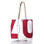 The Sea Bags Vintage 07 Medium Tote features hand-spliced rope handles, a striking red 07 design, and a white Sea Bags tag near the handle. Photographed on a white background, this Maine-crafted bag delivers classic vintage sail tote style for any outing. by Sea Bags