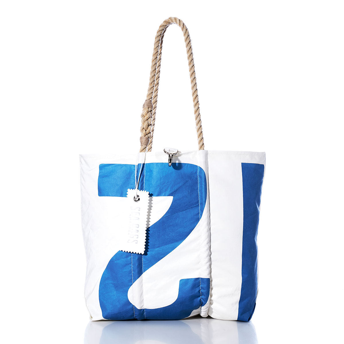Sea Bags Vintage 12 Medium Tote in white and blue, featuring hand-spliced rope handles and a visible tag, displayed against a white background. by Sea Bags