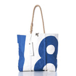 The Sea Bags Vintage 18 Medium Tote is a white tote handcrafted in Maine from durable sailcloth, featuring a bold blue number 18 design. This vintage bag includes rope handles and a rectangular white tag, and is shown on a white background. by Sea Bags