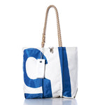 Sea Bags Vintage 15 Medium Tote, featuring white and blue panels, hand-spliced rope handles, and a signature white tag, is photographed on a white background. Inspired by classic sail totes, this piece blends timeless nautical style with practical charm. by Sea Bags