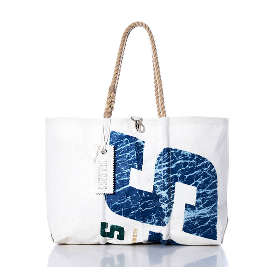 Sea Bags Vintage Sailing Large Tote—white canvas tote featuring a blue printed design, tan rope handles, and a branded tag, inspired by classic sailcloth bags and handmade in Maine—displayed on a white background. by Sea Bags