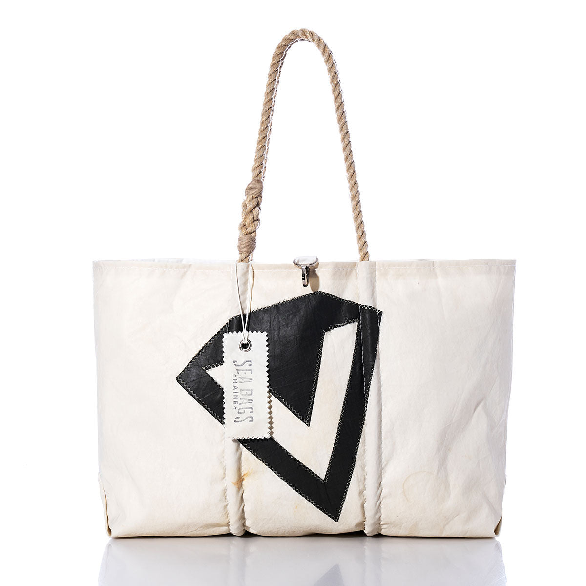 Handcrafted and inspired by nautical style, the Sea Bags Vintage Diamond V Large Tote is a white sailcloth bag featuring rope handles, a bold black geometric design on the front, and a SEA BAGS tag attached to one handle. by Sea Bags