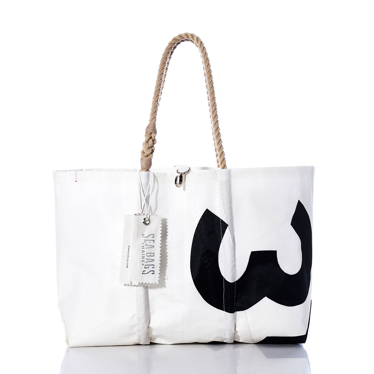 The Sea Bags Vintage 353 Large Tote is a white sail bag with hand-spliced rope handles, accented by a bold black partial number print and finished with an authentic Sea Bags Maine label—a timeless example of Maine craftsmanship. by Sea Bags