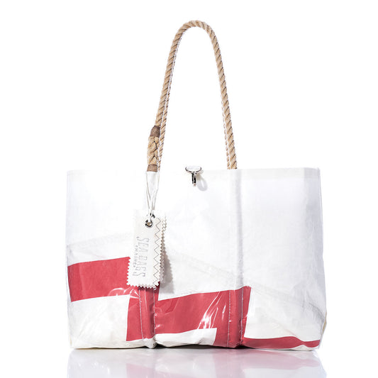 Sea Bags Vintage Lightning Window Large Tote, handcrafted in Maine and inspired by classic sailcloth bags, features red and gray accents, sturdy rope handles, and a rectangular tag. The white tote is photographed on a white background. by Sea Bags