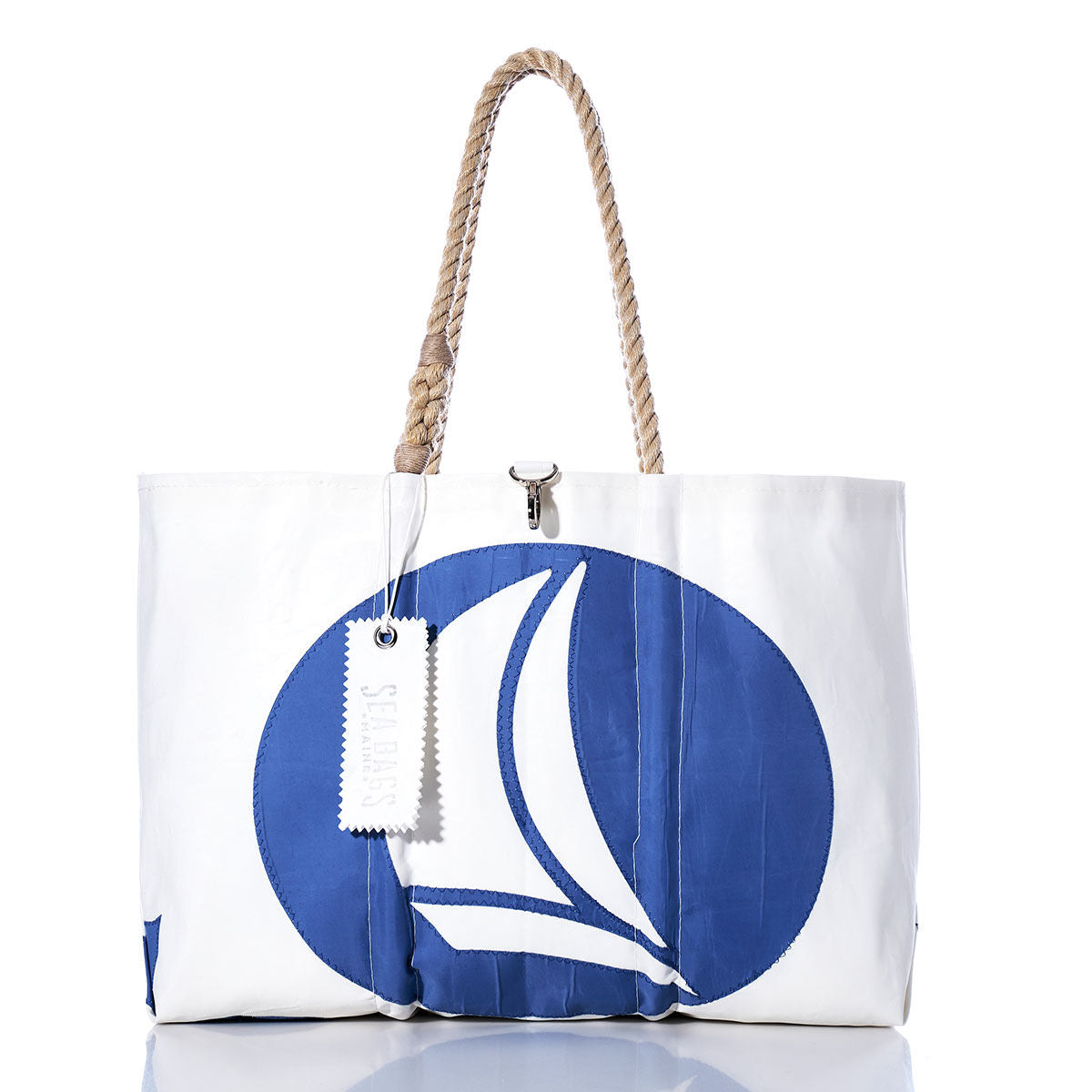 Sea Bags Vintage Hunter Large Tote, featuring a blue sailboat design with hand-spliced rope handles and a classic white tag, all proudly made in Maine. Displayed on a white background. by Sea Bags