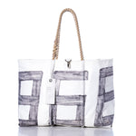 Sea Bags’ Vintage 868 Large Tote—crafted in Maine—features hand-spliced rope handles, bold gray block-style lettering, a small metal clasp, and a tag hanging from one handle for a classic vintage sail-inspired look. by Sea Bags