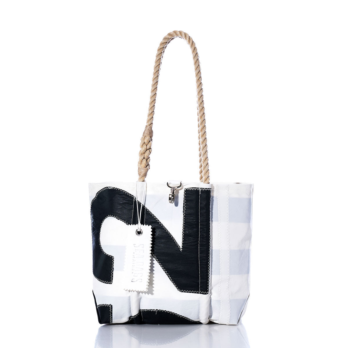 Sea Bags Vintage 162 Handbag featuring a white and black sail insignia, sturdy hemp rope handles, and a visible stitched patch design, photographed on a white background. by Sea Bags