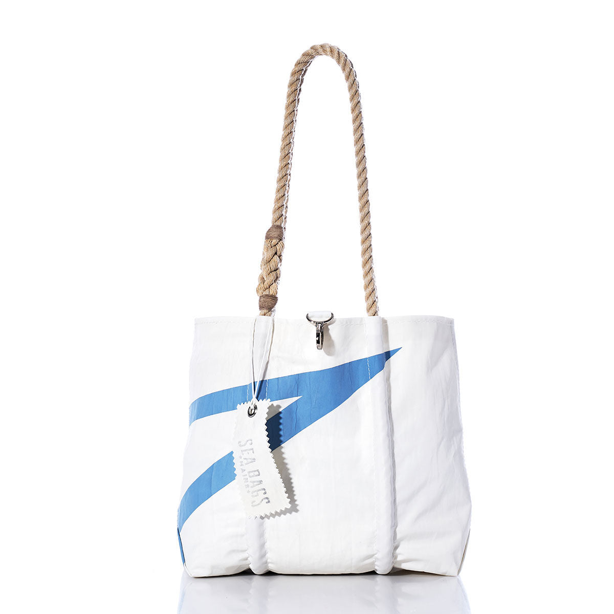 The Vintage Blue Graphic Handbag by Sea Bags features a white body with a bold blue diagonal stripe, hemp rope handles, and a branded Sea Bags tag, shown against a white background. by Sea Bags