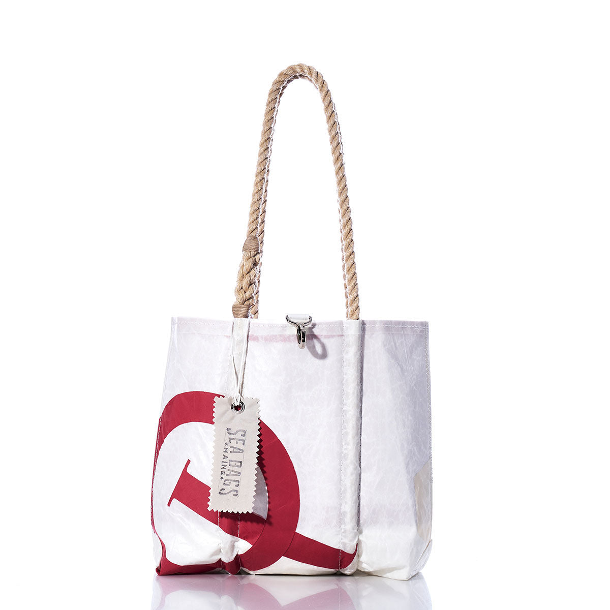 Sea Bags’ Vintage Optimist Handbag—a white tote bag with sturdy hemp rope handles and a bold red circular graphic—features a SEA BAGS tag on one handle and is photographed against a white background. by Sea Bags