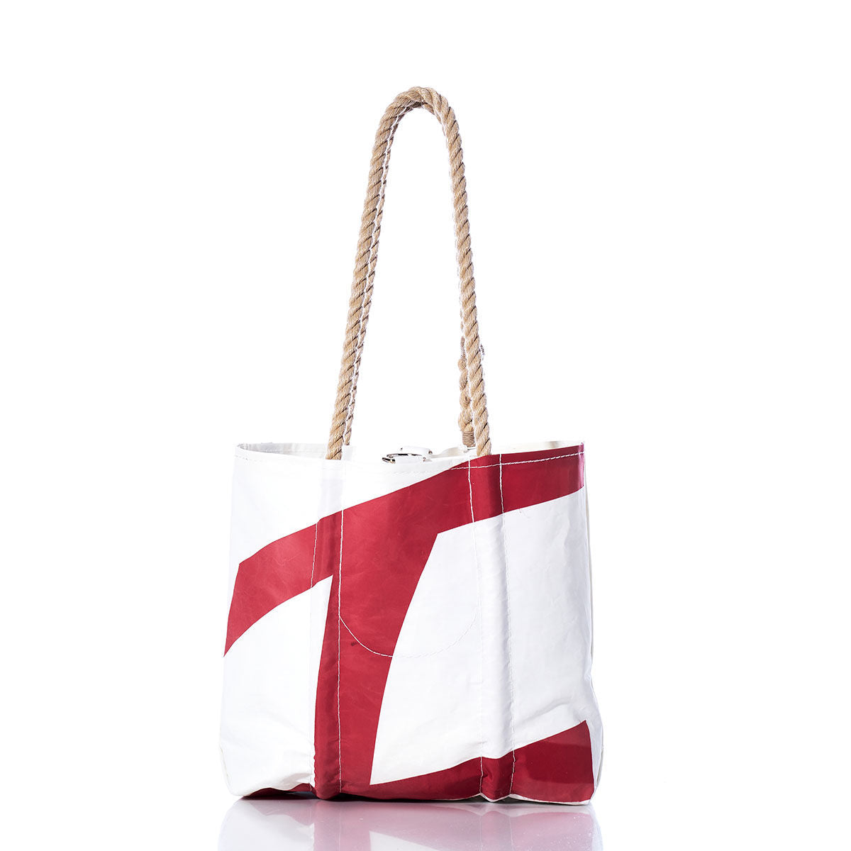 Sea Bags Vintage Harbor 20 Handbag—white tote featuring a bold red geometric pattern inspired by sail insignias and two thick hemp rope handles—displayed on a white background. by Sea Bags