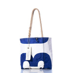 Vintage Blue 13 Handbag by Sea Bags, featuring hemp rope handles and a hanging tag with the Sea Bags logo, showcases subtle sail insignias against its blue and white design, displayed against a white background. by Sea Bags