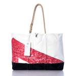Sea Bags Vintage Red and Black Ogunquit Beach Tote, crafted from recycled sail cloth, features a white and black design with a bold red diagonal stripe, rope handles, and a hanging white tag—shown against a white background. by Sea Bags