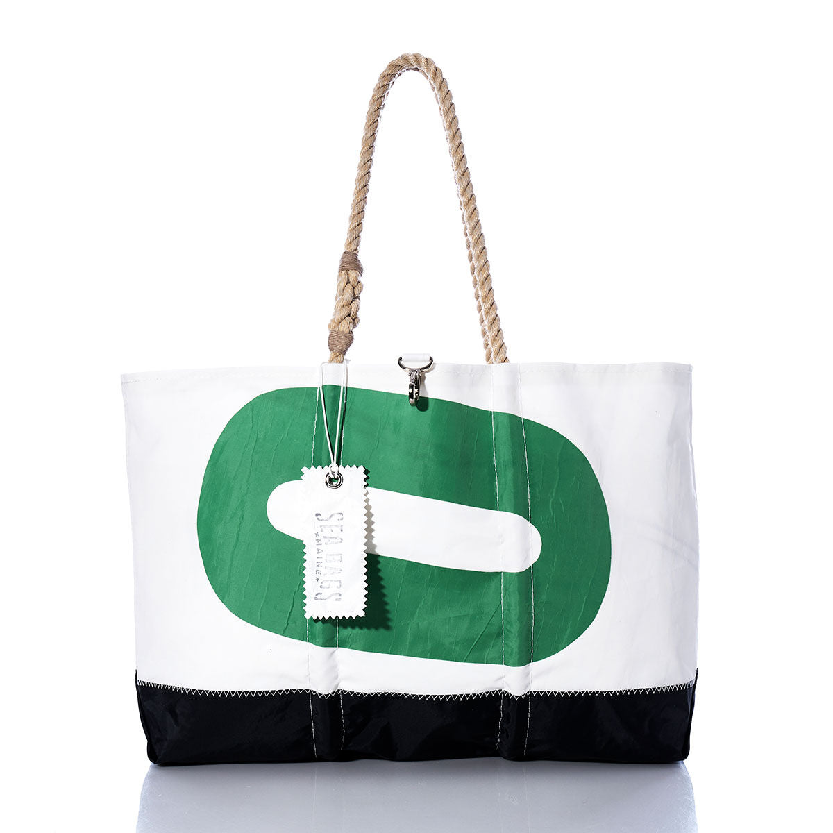 The Sea Bags Vintage Green 0 Ogunquit Beach Tote features a white and black design with a green geometric pattern, sturdy rope handles, and a white tag on the front. Crafted from recycled sail cloth, this tote offers durable, eco-friendly style. by Sea Bags