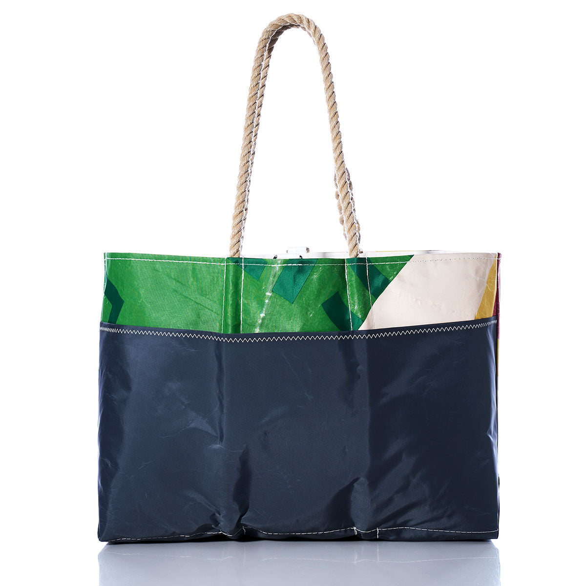 The Vintage Multicolor Ogunquit Beach Tote by Sea Bags is a stylish beach bag made from recycled sail cloth, featuring sturdy rope handles, a navy blue bottom half, and a vibrant multicolored top section in green, yellow, and white. by Sea Bags
