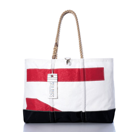 Introducing the Vintage Red 71 Ogunquit Beach Tote by Sea Bags—a spacious white tote bag made from recycled sail cloth, adorned with bold red and black rectangular accents. It features sturdy rope handles and a signature Sea Bags tag attached to one handle, seamlessly combining timeless style and eco-friendly craftsmanship inspired by classic sail designs. by Sea Bags