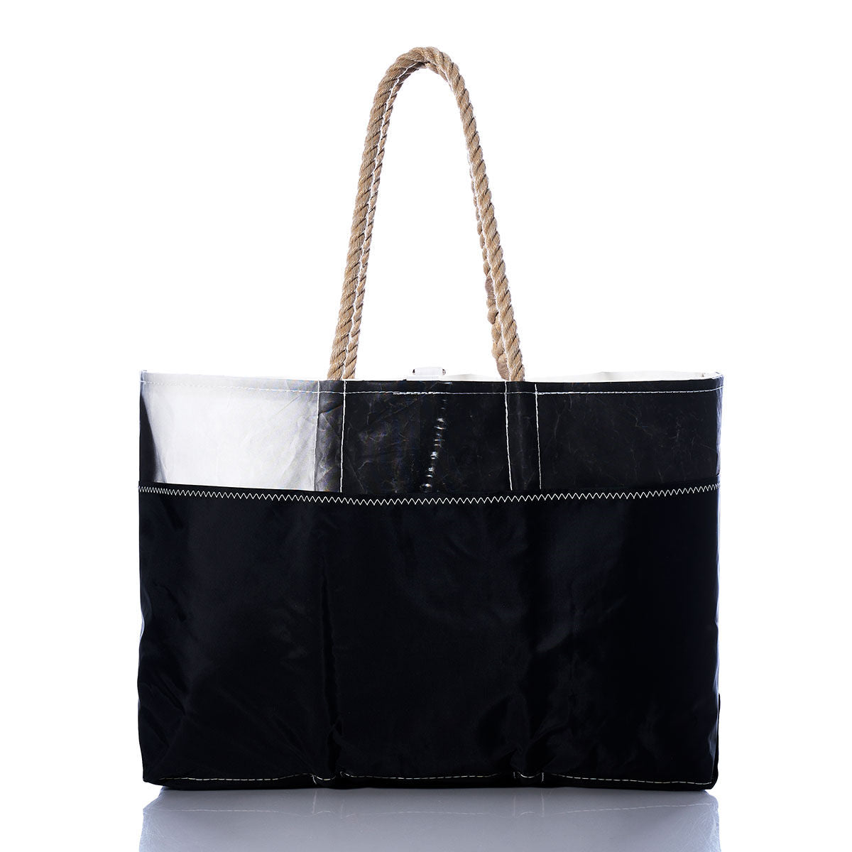 The Vintage Etchells Ogunquit Beach Tote by Sea Bags is a black tote bag featuring a glossy finish, white stitching, and two durable rope handles, made from recycled sail cloth and displayed against a plain white background. by Sea Bags