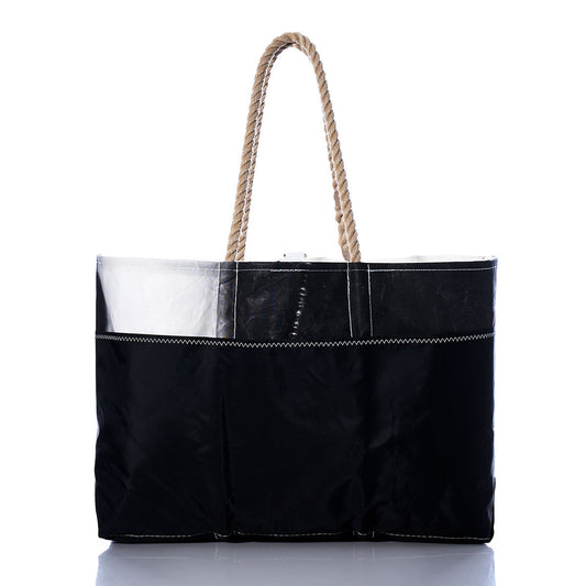 The Vintage Etchells Ogunquit Beach Tote by Sea Bags is a black tote bag featuring a glossy finish, white stitching, and two durable rope handles, made from recycled sail cloth and displayed against a plain white background. by Sea Bags