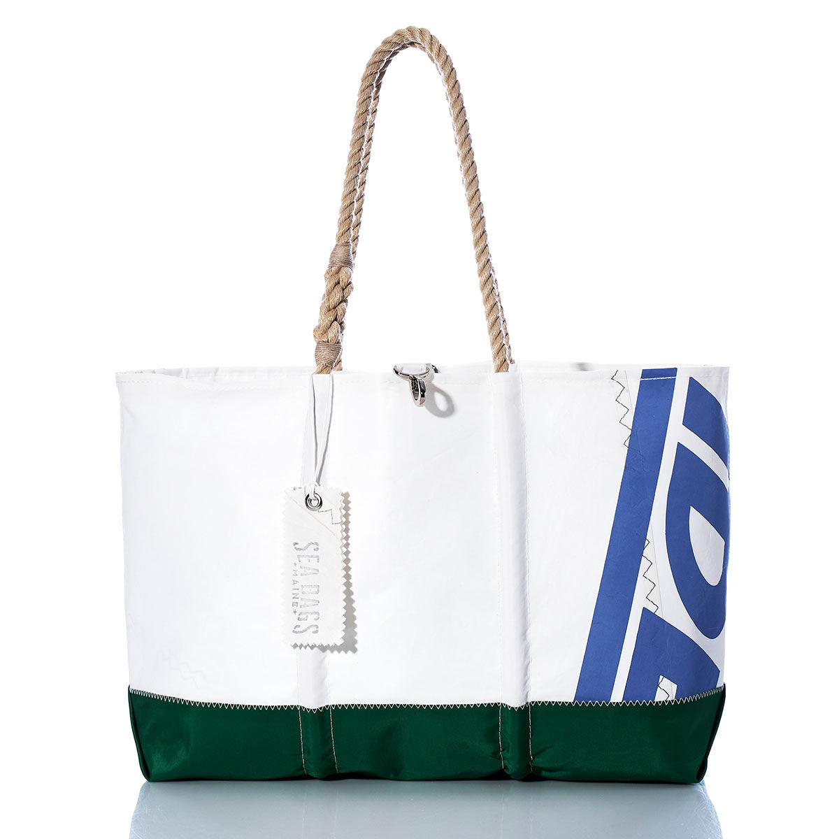 The Sea Bags Vintage ideal18 Ogunquit Beach Tote features a white and green design with rope handles, expertly crafted from recycled sail cloth. This tote showcases a blue pattern on the side and includes a distinctive white tag, all presented against a clean white background. by Sea Bags
