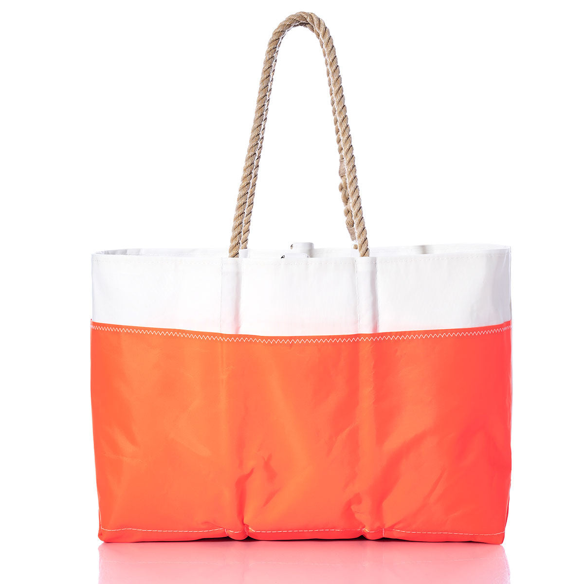 The Vintage Blue 20 Ogunquit Beach Tote by Sea Bags features a white upper paired with a vibrant blue lower section and is accented with thick rope handles, set against a white background. Crafted from recycled sail cloth, this beach tote blends durability with coastal style. by Sea Bags
