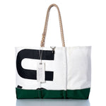 Vintage US-8 Ogunquit Beach Tote by Sea Bags, made from recycled sail cloth in white and green, features black lettering, rope handles, and a white SEABAGS tag, displayed on a white background. by Sea Bags