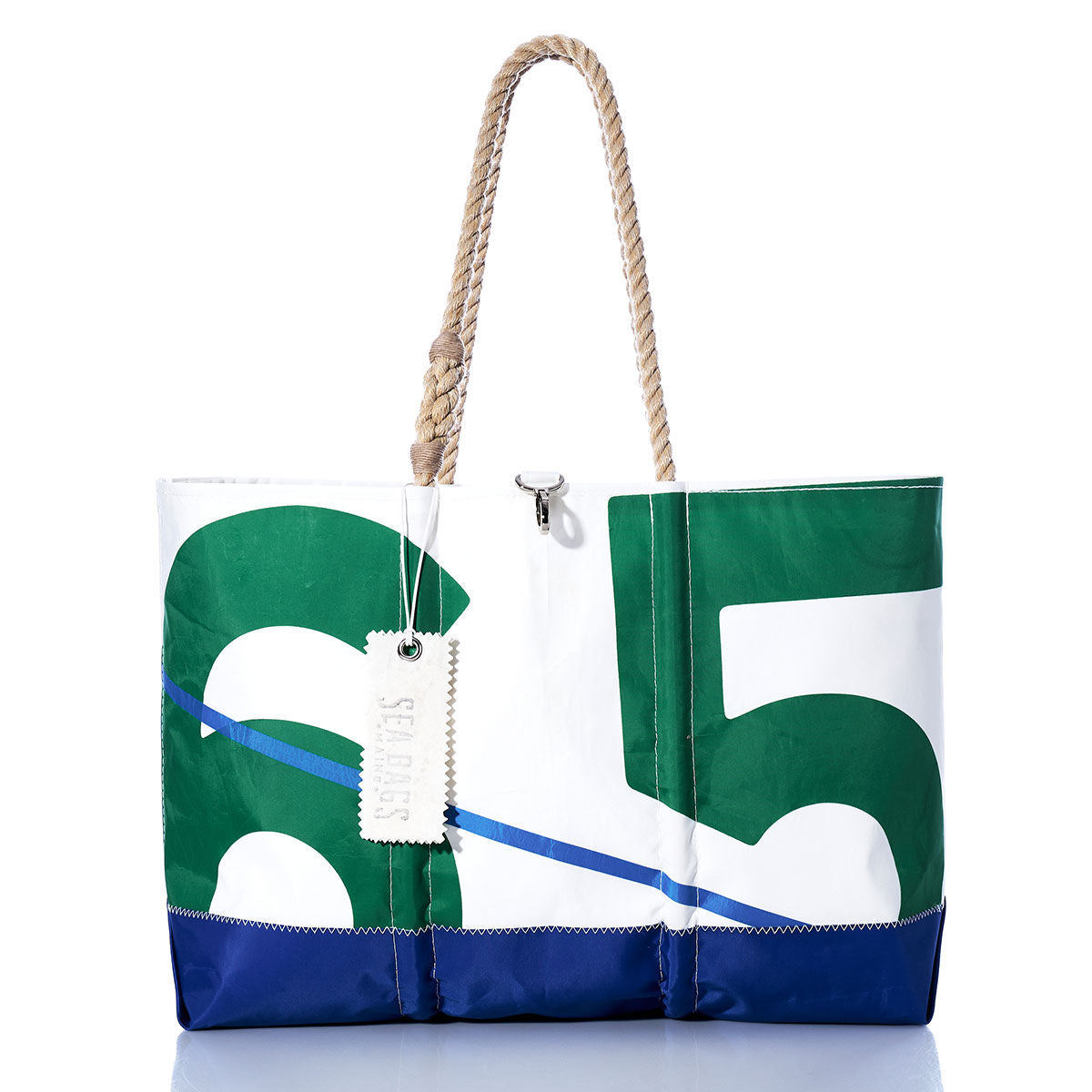 The Vintage Green 65 Ogunquit Beach Tote by Sea Bags is expertly crafted from recycled sail cloth and features a bold green and white number 65 design, a blue base, sturdy rope handles, and a signature white “SEABAGS” tag—making it both stylish and eco-friendly. by Sea Bags