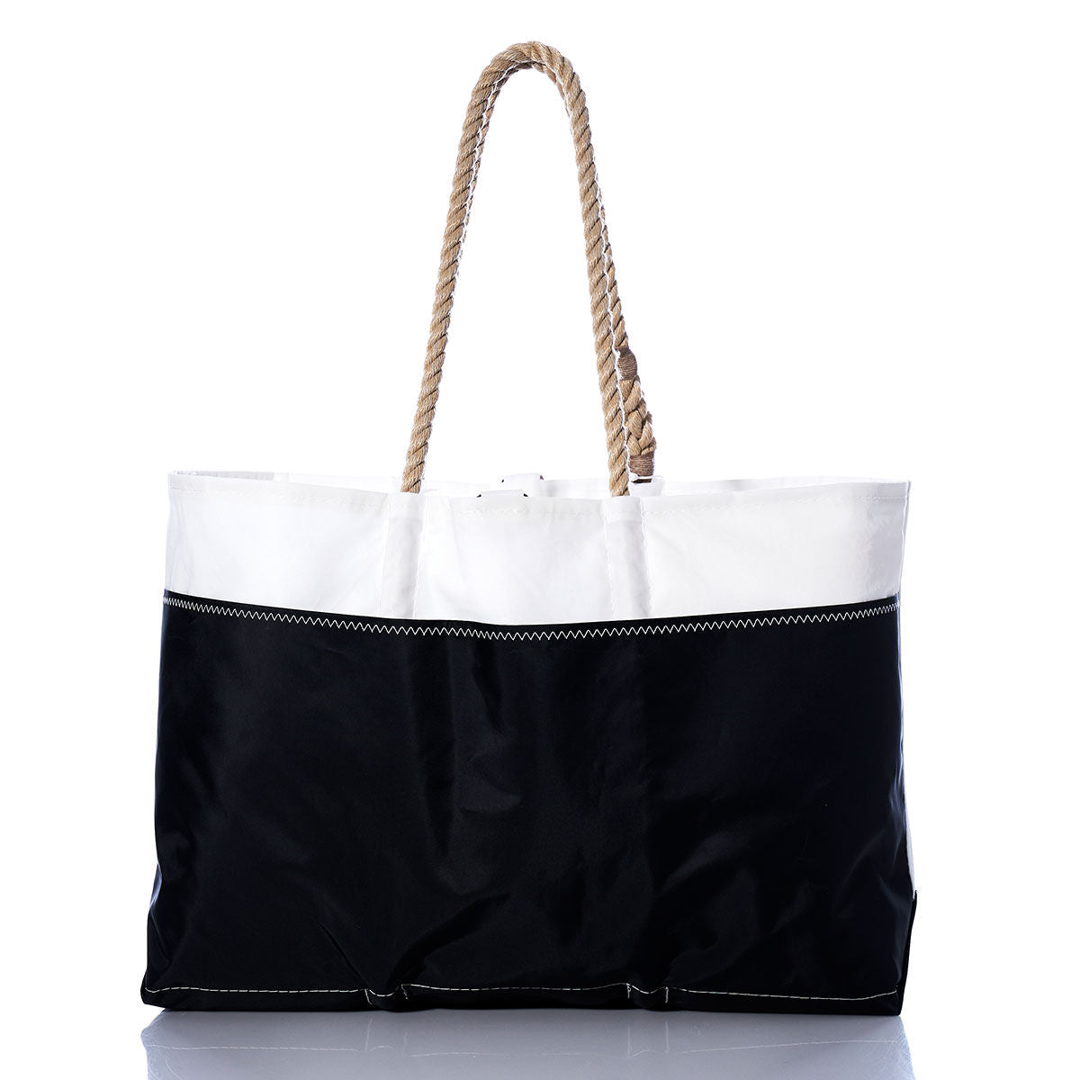 Sea Bags Vintage Red 2 Ogunquit Beach Tote features a spacious design with a black bottom, a white top section crafted from recycled sail cloth, visible stitching, and sturdy rope handles. Photographed against a white background, this tote blends coastal style with durable construction. by Sea Bags