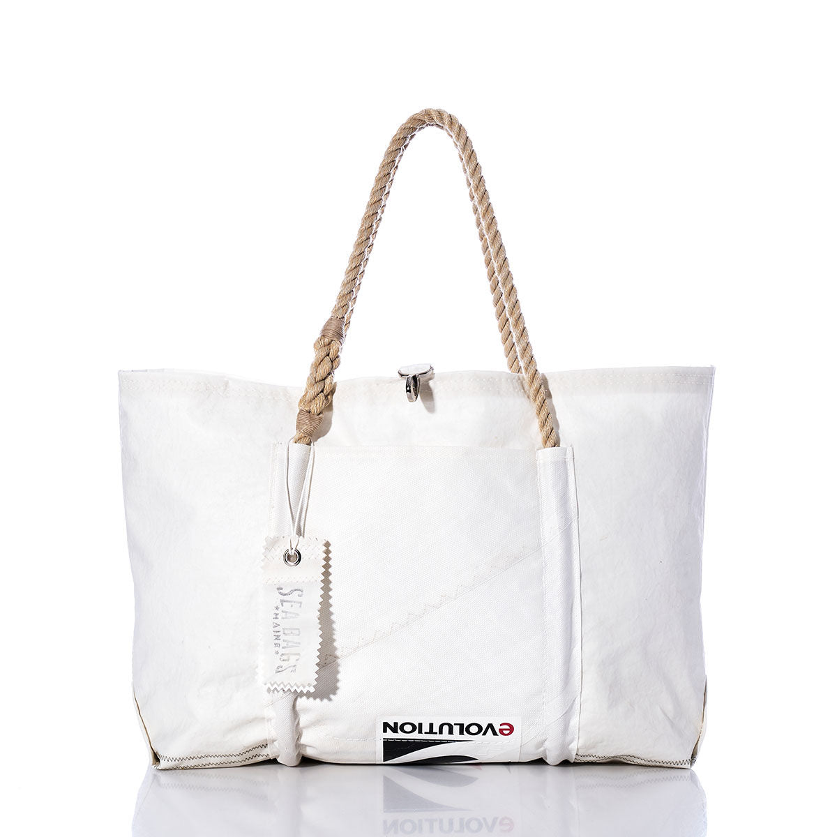 Handcrafted in Maine from recycled sail material, the Sea Bags Vintage Evolution Wharf Tote features a spacious white design with rope handles, a small zipper tag, and the word EVOLUTION partially visible along the lower front—blending classic style with sustainable craftsmanship. by Sea Bags
