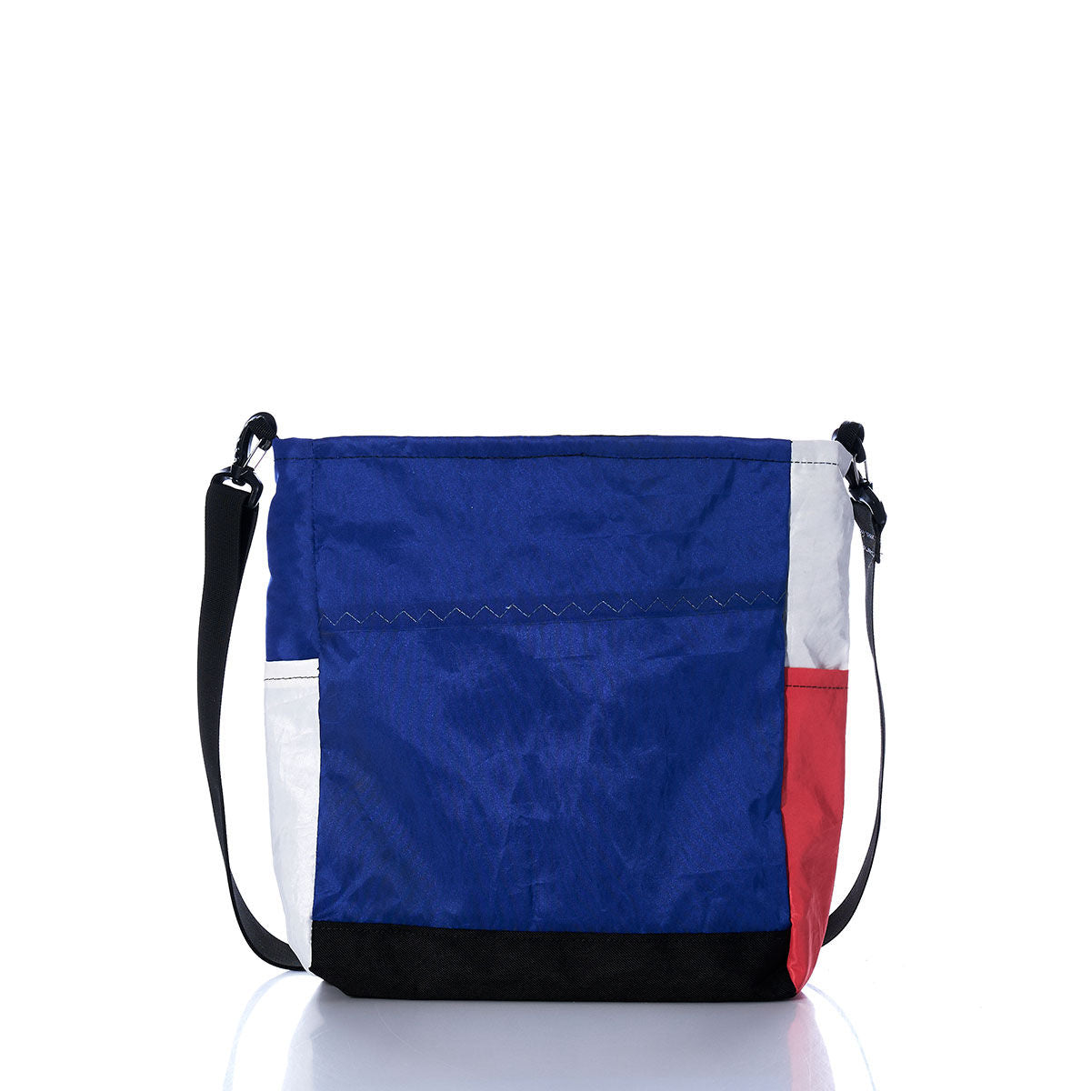 The Vintage Blue and Orange Medium Voyager Crew Crossbody by Sea Bags is crafted from recycled sail cloth and features bold blue and orange color-blocked panels, complemented by a black adjustable strap and visible front stitching. This sustainable crossbody bag is displayed against a white background. by Sea Bags