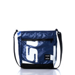 The Sea Bags Vintage White S Medium Voyager Crew Crossbody is a sustainable blue and white bag featuring a black adjustable strap, a front zipper pocket, and two logo patches near the bottom. Made from recycled polyester, it is displayed on a white background. by Sea Bags