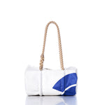 The Sea Bags Vintage JY Baguette Bag is a white rectangular bag adorned with a blue design, featuring a sturdy hand-spliced hemp rope handle and understated sail insignias, showcased against a plain white background. by Sea Bags
