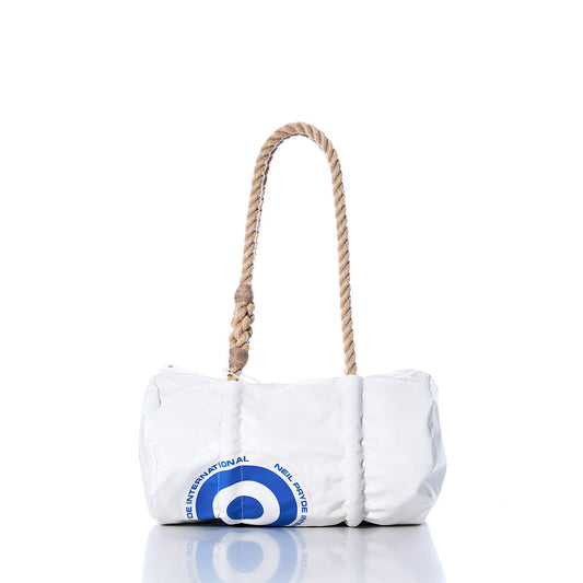 The Sea Bags Vintage Neil Pryde Baguette Bag features a white exterior adorned with a blue circular design reminiscent of a sail insignia at the bottom left and is finished with a thick, twisted rope handle. Displayed against a white background, this bag channels the timeless charm of sailing heritage. by Sea Bags