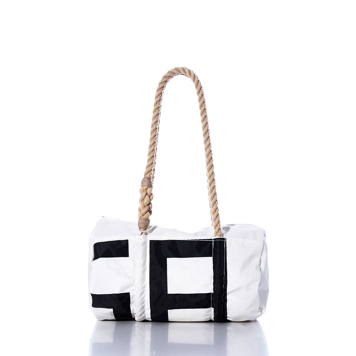 The Vintage SA Baguette Bag by Sea Bags is a white cylindrical bag with black geometric accents, featuring hand-spliced rope handles and shown against a plain white background. by Sea Bags