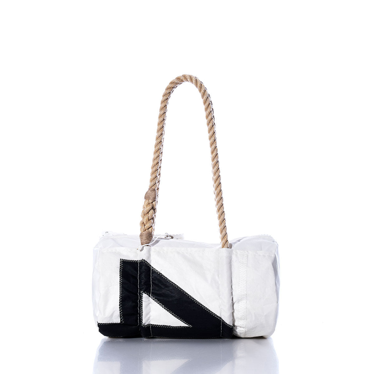 The Sea Bags Vintage 45 Baguette Bag, featuring a white and black rectangular sailcloth design with hand-spliced rope handles, is displayed against a white background. by Sea Bags