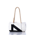 The Sea Bags Vintage 45 Baguette Bag, featuring a white and black rectangular sailcloth design with hand-spliced rope handles, is displayed against a white background. by Sea Bags