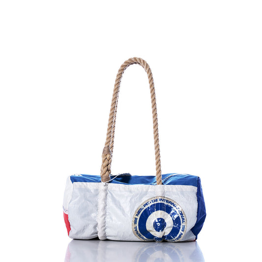 The Sea Bags Vintage Neil Pryde Baguette Bag, crafted from recycled white, blue, and red sail material, features rope handles and a printed circular logo on the front, shown photographed against a white background. by Sea Bags