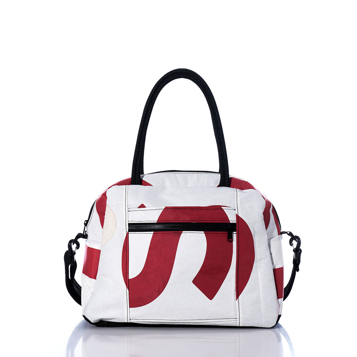 Sea Bags Vintage US Essential Weekender Travel Bag—a white carryon featuring bold red abstract patterns, black double handles, a front zip pocket, and side clasps—is shown on a reflective white surface. by Sea Bags