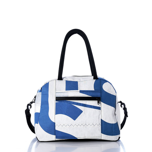 The Sea Bags Vintage Blue A Essential Weekender Travel Bag is showcased against a plain white background, featuring a stylish white and blue design with black handles, a front zippered pocket, a detachable shoulder strap, and an easy-access trolley sleeve—ideal for use as a compact carry-on. by Sea Bags