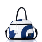 The Sea Bags Vintage Blue Numbers Essential Weekender Travel Bag features a compact blue and white design with black handles, a front zipper pocket, detachable shoulder strap, and a signature Sea Bags tag on the zipper—perfect as a stylish carryon inspired by vintage blue style for your next adventure. by Sea Bags