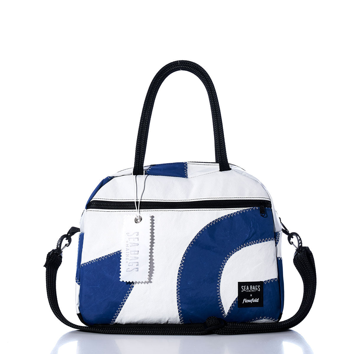 The Sea Bags Vintage Blue Numbers Essential Weekender Travel Bag features a compact blue and white design with black handles, a front zipper pocket, detachable shoulder strap, and a signature Sea Bags tag on the zipper—perfect as a stylish carryon inspired by vintage blue style for your next adventure. by Sea Bags