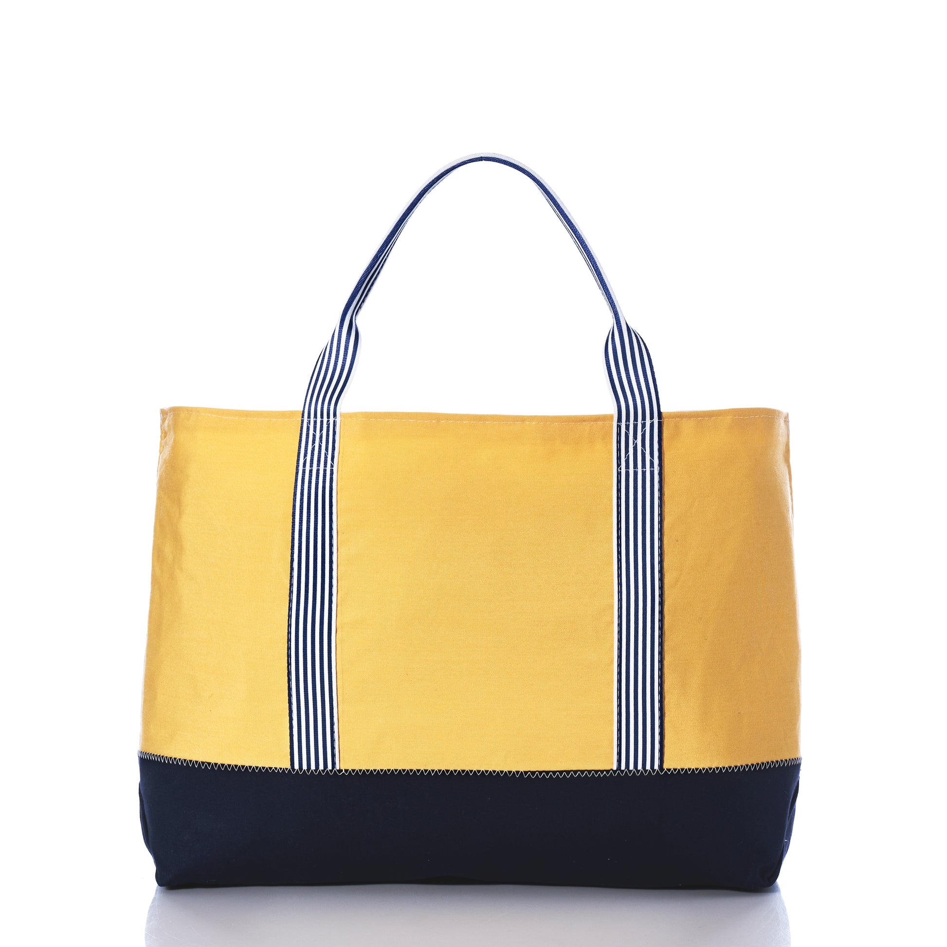 Introducing the Sea Bags Vintage Yellow Canvas Large Tote from their Heritage Collection, this limited edition bag features a striking yellow canvas design complemented by a black bottom and black-and-white striped handles, beautifully showcased on a white background. by Sea Bags
