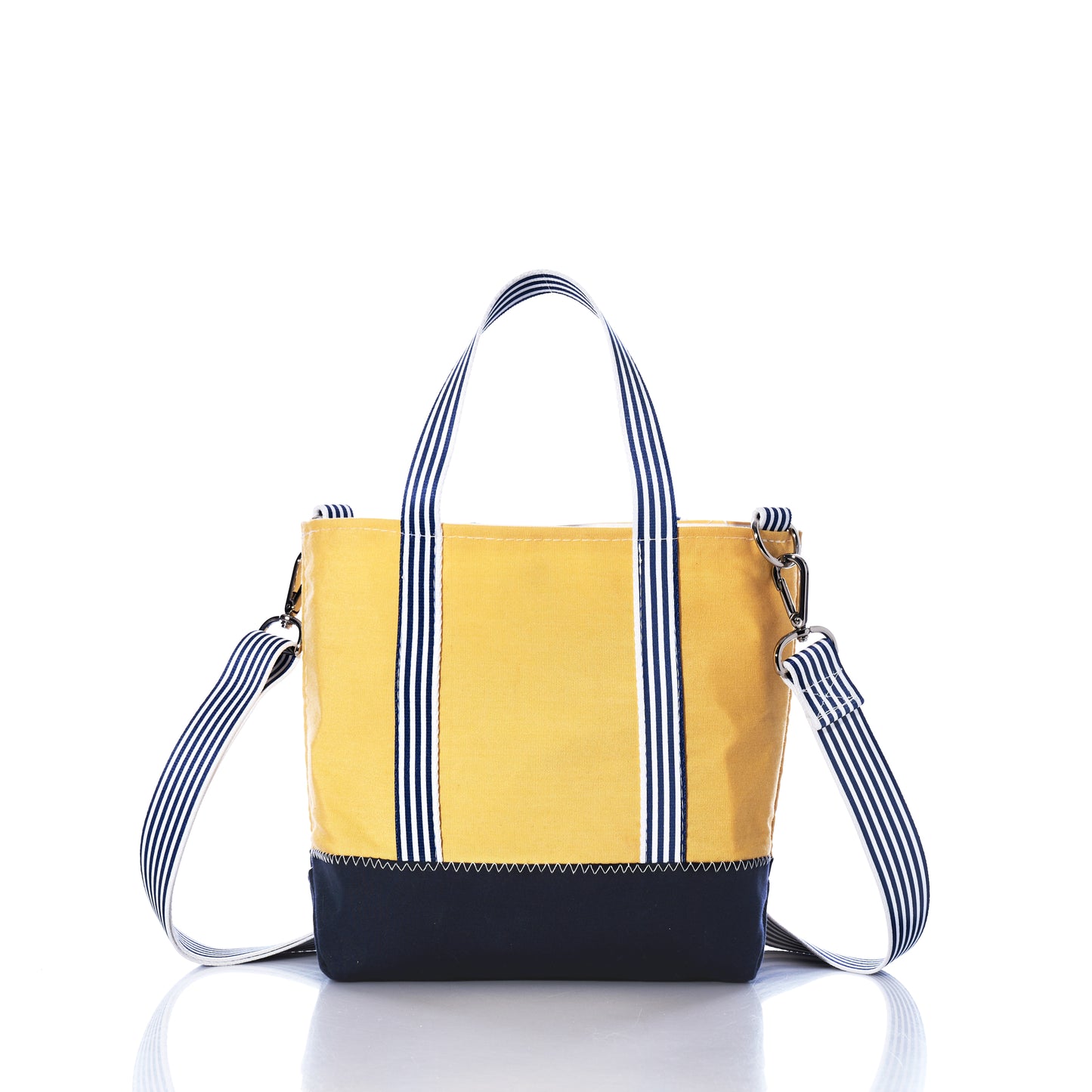 The Sea Bags Vintage Yellow Canvas Crossbody Tote is a limited edition bag crafted from butter yellow canvas sail, featuring white and navy striped handles and a detachable shoulder strap, shown here against a white background. by Sea Bags