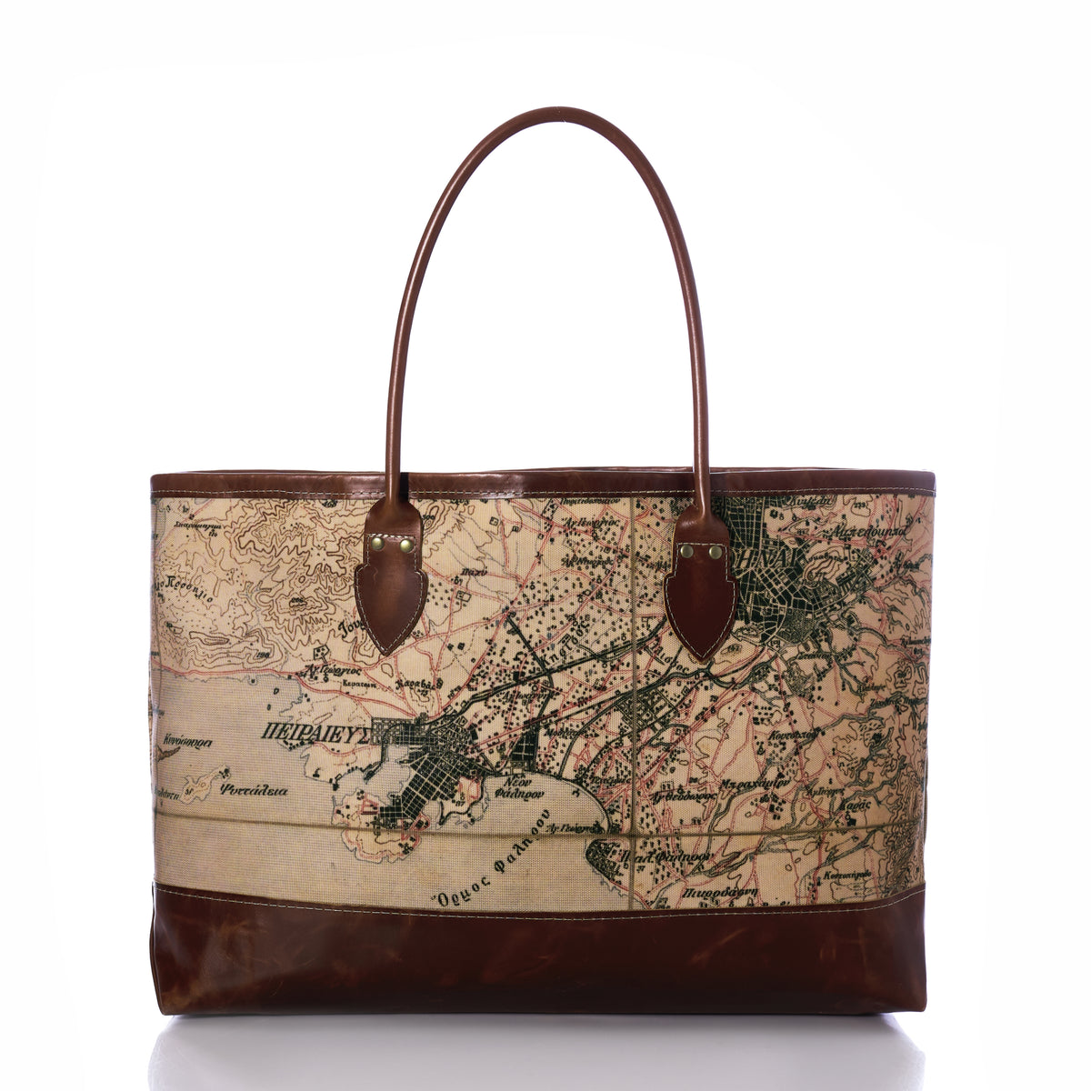 A vintage-style tote bag featuring an antique map print on the main body and dark brown leather trim, handles, and base, shown against a plain white background.
