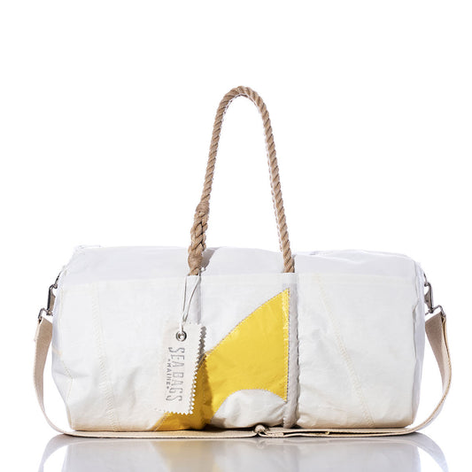 Sea Bags Vintage C Scow Duffel—a white duffel bag made from recycled sail cloth, featuring a yellow geometric design, rope handles, authentic sail insignias, and a signature Sea Bags tag—displayed against a white background. by Sea Bags