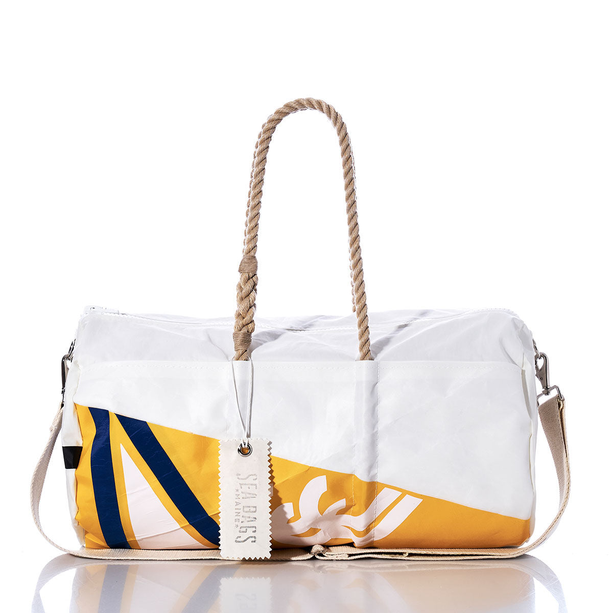 The Sea Bags Vintage Yellow Burgee Duffel is crafted from recycled sail cloth and features a white and yellow design with blue and yellow accents. It includes hemp rope handles, a canvas shoulder strap, and a tag reading “SEABAGS.” The bag is shown on a white background. by Sea Bags