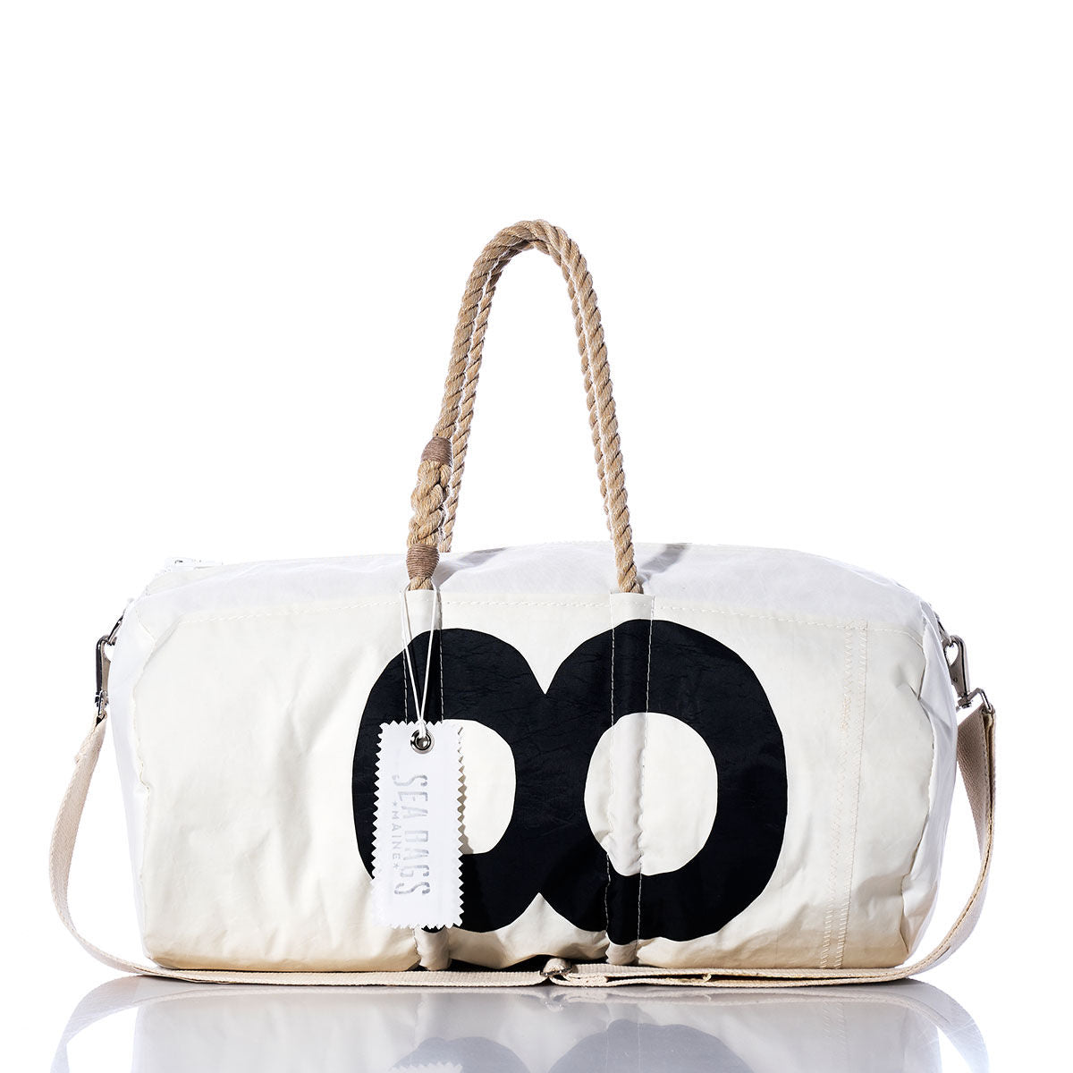 Vintage S8 Duffel by Sea Bags, crafted from recycled sail cloth with black circular sail insignias, features rope handles, a tan shoulder strap, and a visible SEA BAGS tag; displayed against a white background. by Sea Bags